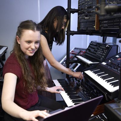 Two Electronic & Produced Music students in a studio